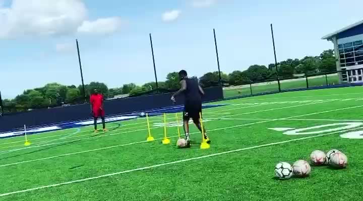 Cone Dribbling Circuit — Close-control dribbling through poles and cones at full speed.